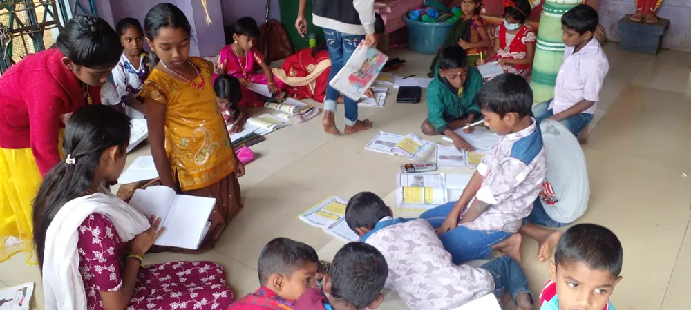 Underprivileged children get fed in Higurugama, Sri Lanka.